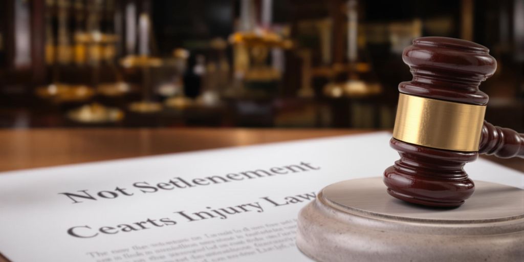 Gavel and legal documents in a courtroom setting.